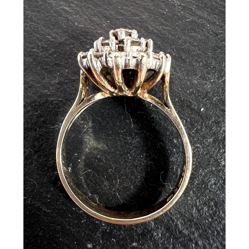 680 - A 9ct yellow gold ring with 19 diamonds in flowerhead setting, 3.8gm gross.