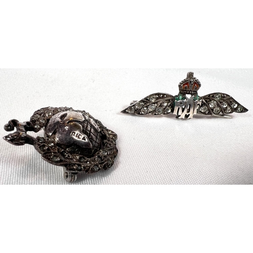 686 - A silver RAF badge with clear stone studded wings and a similar maritime badge with globe and lion.