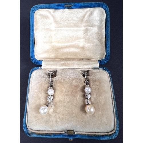 688 - A pair of pearl and diamond drop earrings in a white gold screw on fitting, stamped 9ct, in original... 