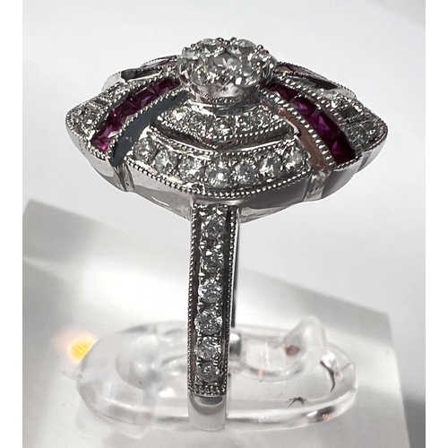 690 - An Art Deco diamond and ruby white gold ring stamped 18ct, diamond content 0.51carat, ruby 0.30 cara... 