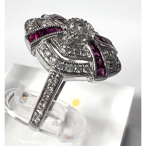 690 - An Art Deco diamond and ruby white gold ring stamped 18ct, diamond content 0.51carat, ruby 0.30 cara... 