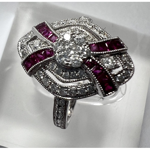 690 - An Art Deco diamond and ruby white gold ring stamped 18ct, diamond content 0.51carat, ruby 0.30 cara... 