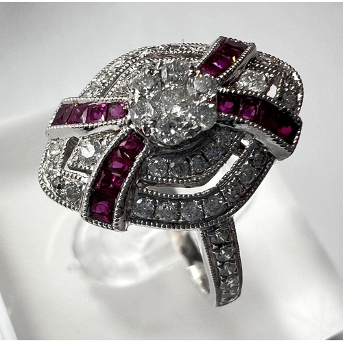 690 - An Art Deco diamond and ruby white gold ring stamped 18ct, diamond content 0.51carat, ruby 0.30 cara... 