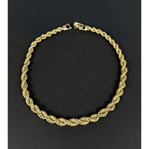 702 - A heavy yellow metal rope twist chain, stamped 14kt, 66.6gms, length 38cm.