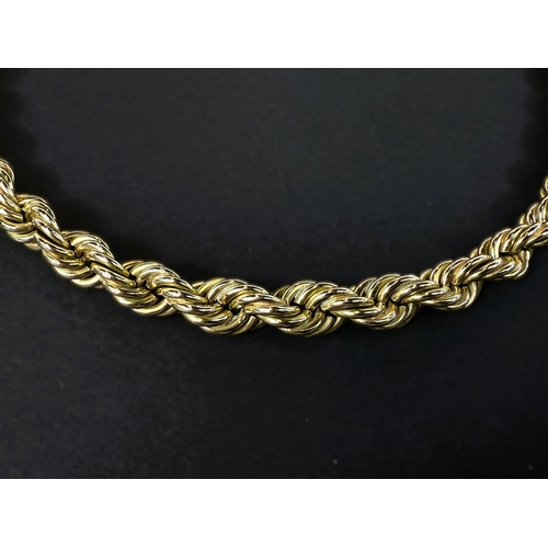 702 - A heavy yellow metal rope twist chain, stamped 14kt, 66.6gms, length 38cm.