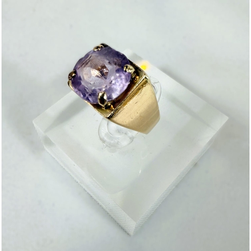 703 - A 9ct hallmarked gold ring set with a large amethyst, 4.3gms, size K