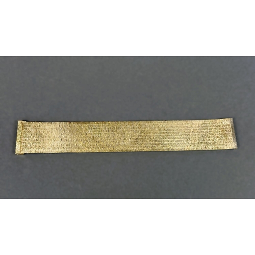 704 - A wide 9ct hallmarked gold bark effect bracelet, 69.5gms, length 18.5cm.