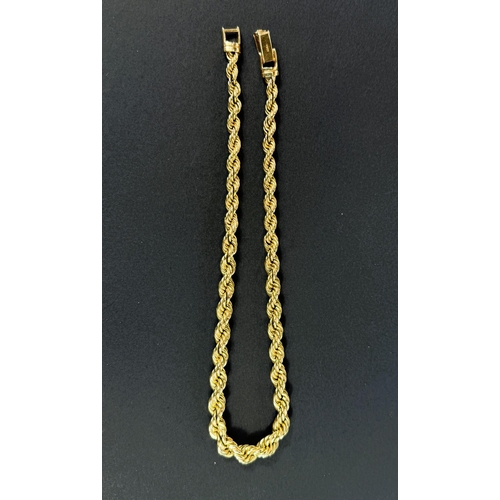 704 - A wide 9ct hallmarked gold bark effect bracelet, 69.5gms, length 18.5cm.