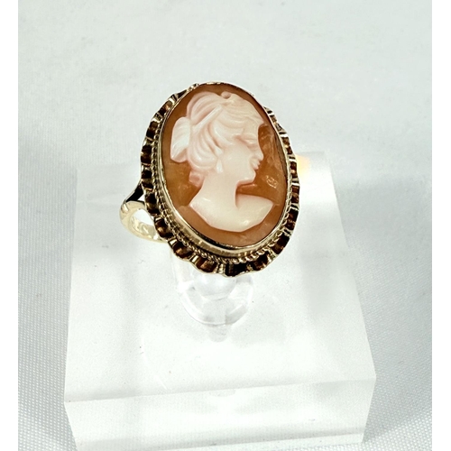 708 - A 9ct hallmarked gold ring set with a female head cameo, 3.5gms, size N.