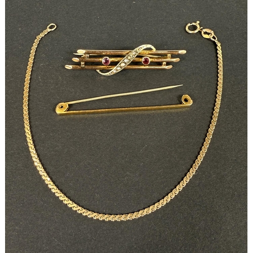 712 - A triple bar yellow metal brooch set with seed pearl link crossover (some pearls are missing); a  pl... 