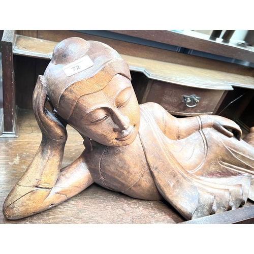 72 - A large carved figure of reclining Buddha, length 70cm.