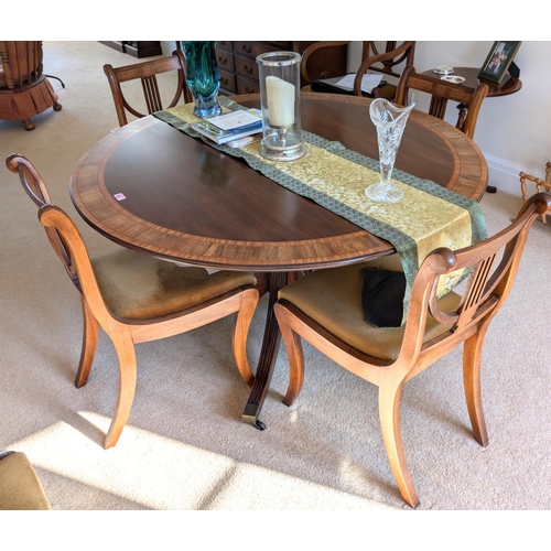 858 - A good quality mahogany reproduction extending pedestal dining table with four splay feet under colu... 