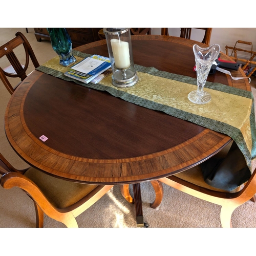 858 - A good quality mahogany reproduction extending pedestal dining table with four splay feet under colu... 