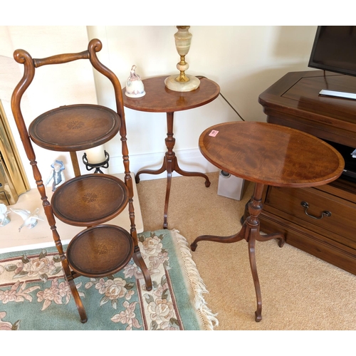 864 - A pair of good quality inlaid mahogany occasional tables on splay legs and a three height cake stand... 