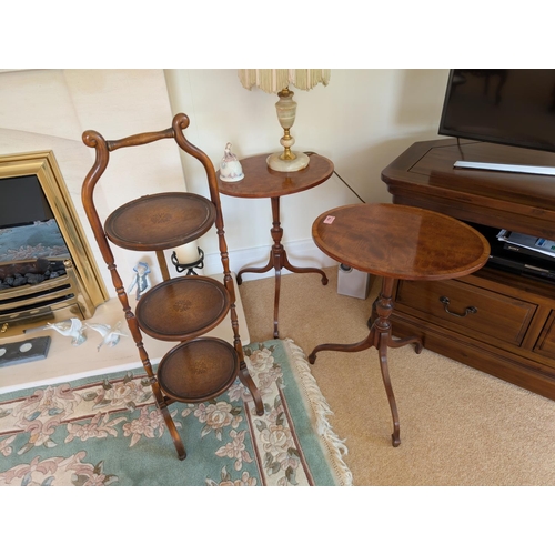 864 - A pair of good quality inlaid mahogany occasional tables on splay legs and a three height cake stand... 