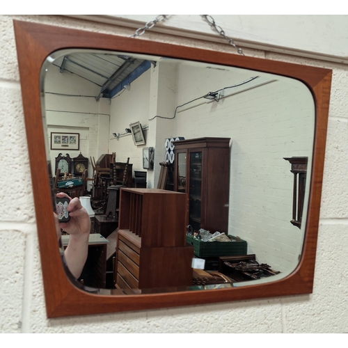 882A - A mid 20th century teak framed shaped mirror