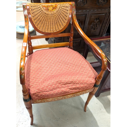 889 - A reproduction Adams style arm chair with hand painted floral decoration with bergere back and seat