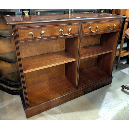 895 - A reproduction mahogany bookcase with drawers above.