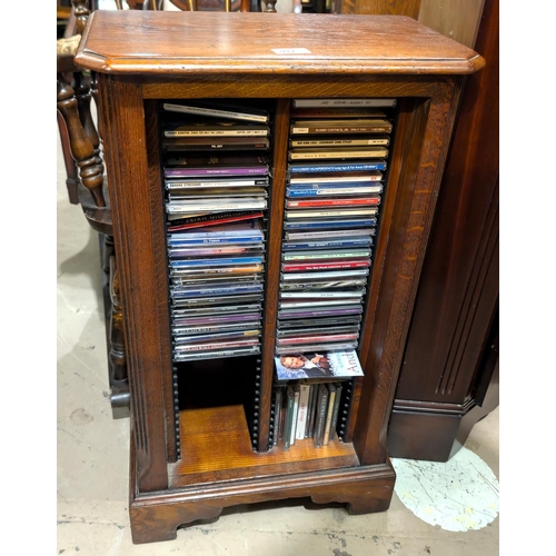 912 - An oak nest of three tables and an oak Titchmarsh and Goodwin CD rack.