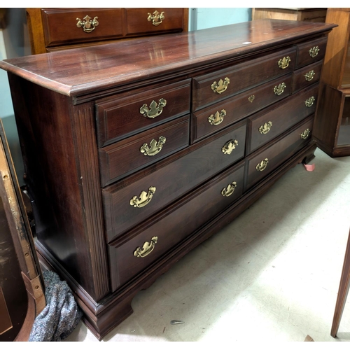 919 - A large reproduction mahogany chest of drawers with 6 long and 4 short drawers.  Length 172 x 8... 