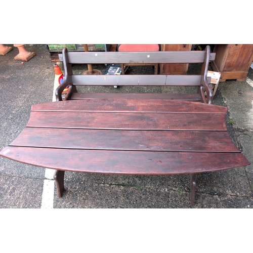 922 - A stained wood garden table and a similar stained wood garden bench.