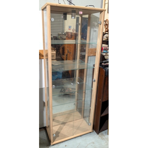 925 - A modern five height glass display cabinet, height 176cm, width 66cm.