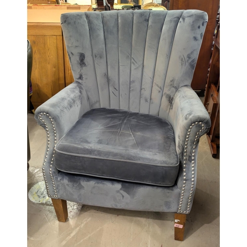 928 - An Art Deco style modern high back arm chair with grey velvet-like upholstery.