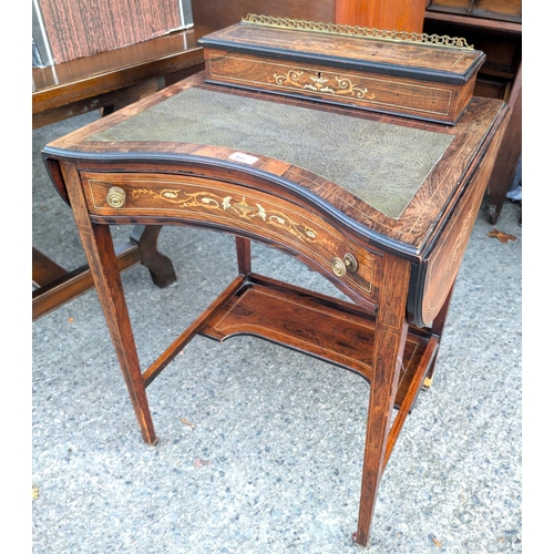 931 - A 19th century rosewood writing desk with drop flaps, single inlaid drawer with letter rack to back,... 