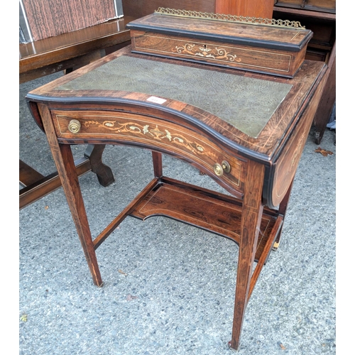 931 - A 19th century rosewood writing desk with drop flaps, single inlaid drawer with letter rack to back,... 