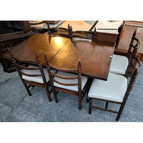 932 - A Younger Toledo oak extending dining table with interior leaf, 6 dining chairs and a matching corne... 