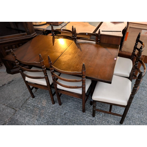 932 - A Younger Toledo oak extending dining table with interior leaf, 6 dining chairs and a matching corne... 