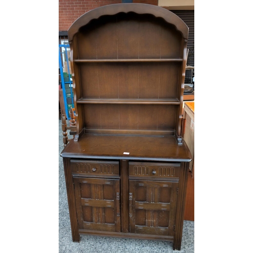 933 - A Priory Dutch dresser with arch top, two shelves, two drawers and doors below.