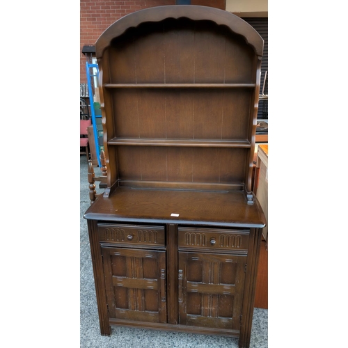 933 - A Priory Dutch dresser with arch top, two shelves, two drawers and doors below.