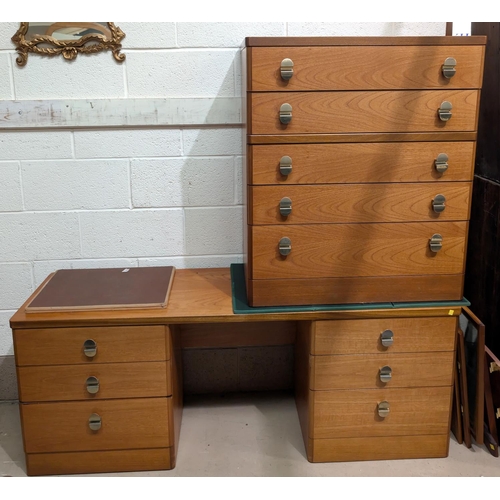 936 - A Stag teak chest of five drawers and a matching desk/dressing table.