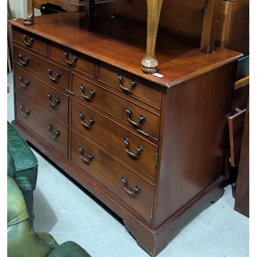 938 - A reproduction mahogany chest with hinged lid disguised by drawers and cupboards, length 115cm, and ... 