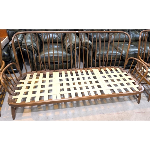 946 - An Ercol three piece low seat settee and and two arm chairs