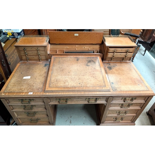 963 - Galloway and Sykes Aberdeen:- an Arts and Crafts oak kneehole desk with 2 raised 3 height galleried ... 