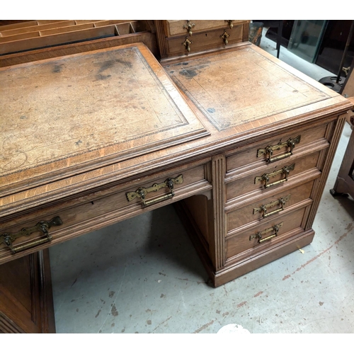 963 - Galloway and Sykes Aberdeen:- an Arts and Crafts oak kneehole desk with 2 raised 3 height galleried ... 