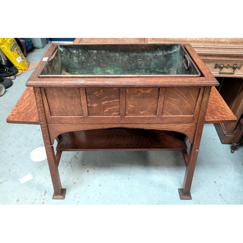 964 - Goodall, Lamb and Heighway Manchester, a large Arts and Crafts style oak planter with metal lines si... 