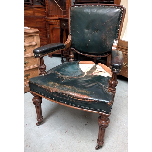 965 - Lamb of Manchester, an oak framed armchair upholstered in buttoned dark green hide, on turned and fl... 