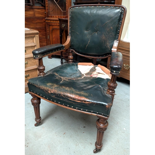 965 - Lamb of Manchester, an oak framed armchair upholstered in buttoned dark green hide, on turned and fl... 