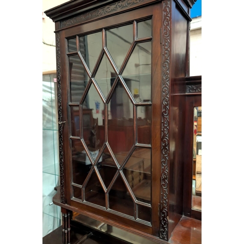 968 - An Edwardian Chippendale style mahogany display cabinet with blind fret and pierced decoration, the ... 