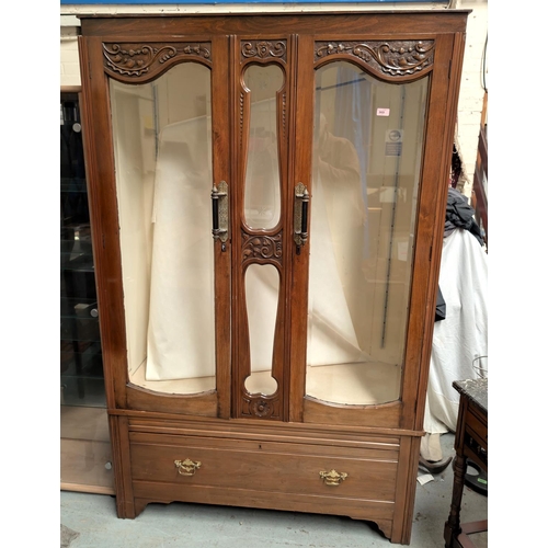 969 - An Edwardian walnut wardrobe converted to display cabinet and ended by two bevelled glass doors with... 