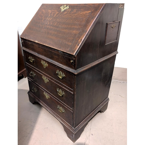 972 - A 19th oak century bureau with fall front, well beneath writing surface and drawers below