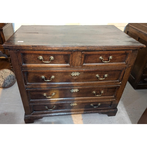 977 - A Georgian oak chest of 3 long and 2 short drawers.