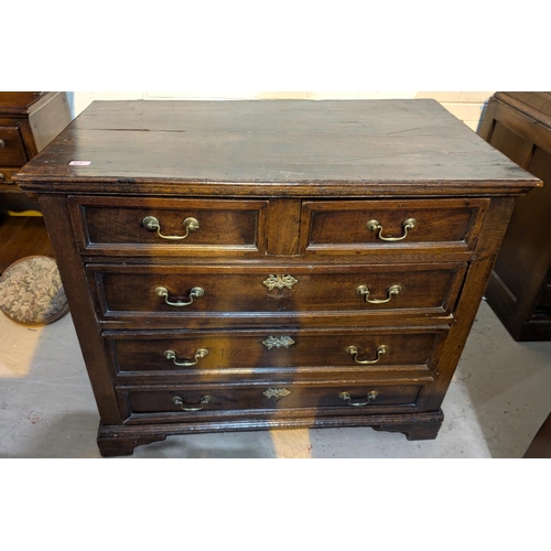 977 - A Georgian oak chest of 3 long and 2 short drawers.