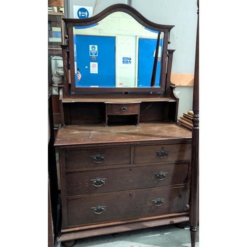 990 - A 1930's oak dressing chest with boxwood inlay to the mirror, two long and two short drawers below, ... 