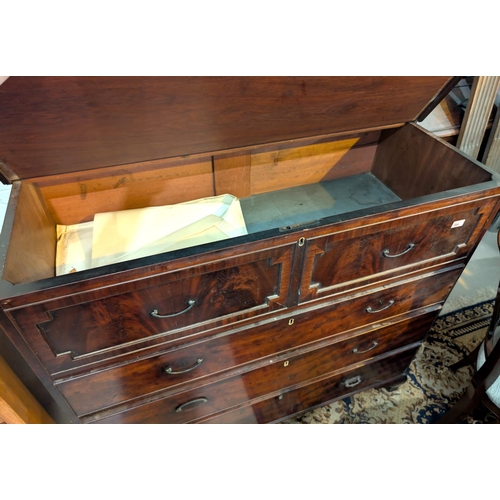 994 - A Georgian mahogany chest with hinged top section and three long drawers below with panelled drawers... 