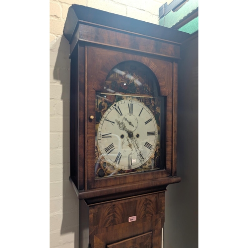 996 - An early 19th Century figured mahogany long case clock with arched painted dial and eight day moveme... 