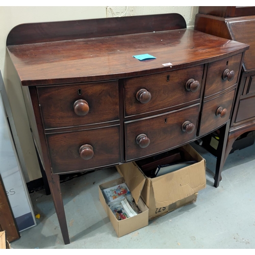 997 - A 19th Century mahogany bow front chest of drawers with two deep drawers and two central drawers, wi... 